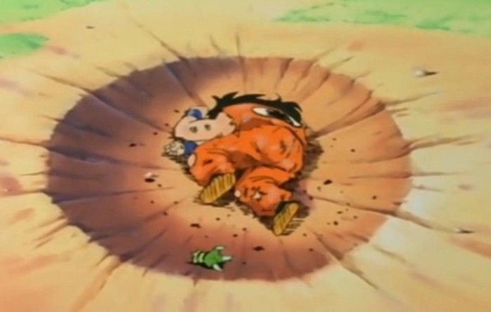 Yamcha laying dead inside a crater.